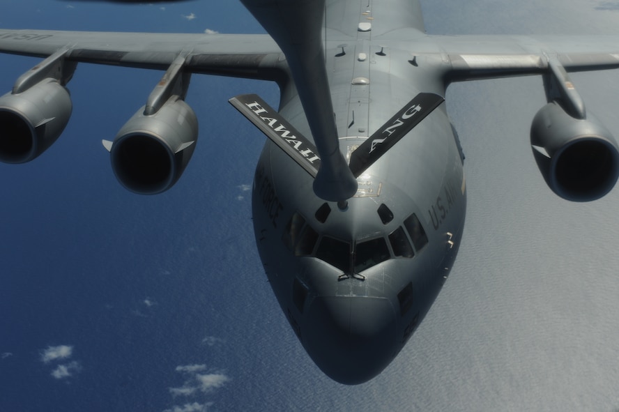 OVER THE PACIFIC -- A C-17 Globemaster III from the 15th Wing, Joint Base Pearl Harbor Hickam, takes on fuel from a Hawaii Air National Guard 204th Air Refueling Squadron KC-135 Stratotanker during a mission to Andersen Air Base, Guam.  The 15th Wing and the Hawaii National Guard?s 154th Wing operate both the C-17 and the KC-135 in a Total Force Integration partnership. They also operate the F-22 Raptor. (U.S. air Force photo/Staff Sgt. Mike Meares)