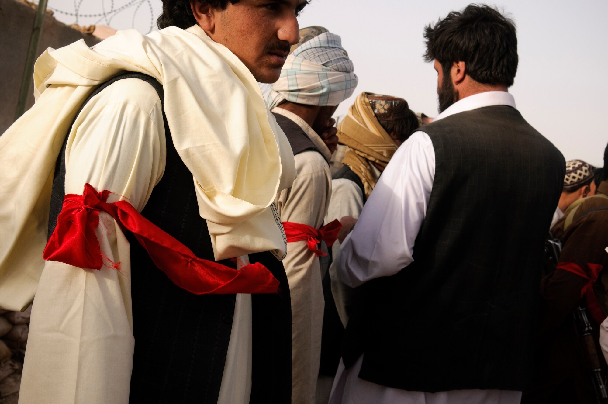 SHAH JOY, Afghanistan - Members of Arbakai stand in formation after receiving their red armband during a ceremony at Forward Operating Base Varner, Shah Joy District, Zabul province, Sept. 16, 2010. Arbakai, part of the commerce stability program in Shah Joy District, will operate security checkpoints to protect the Shah Joy bazaar. 