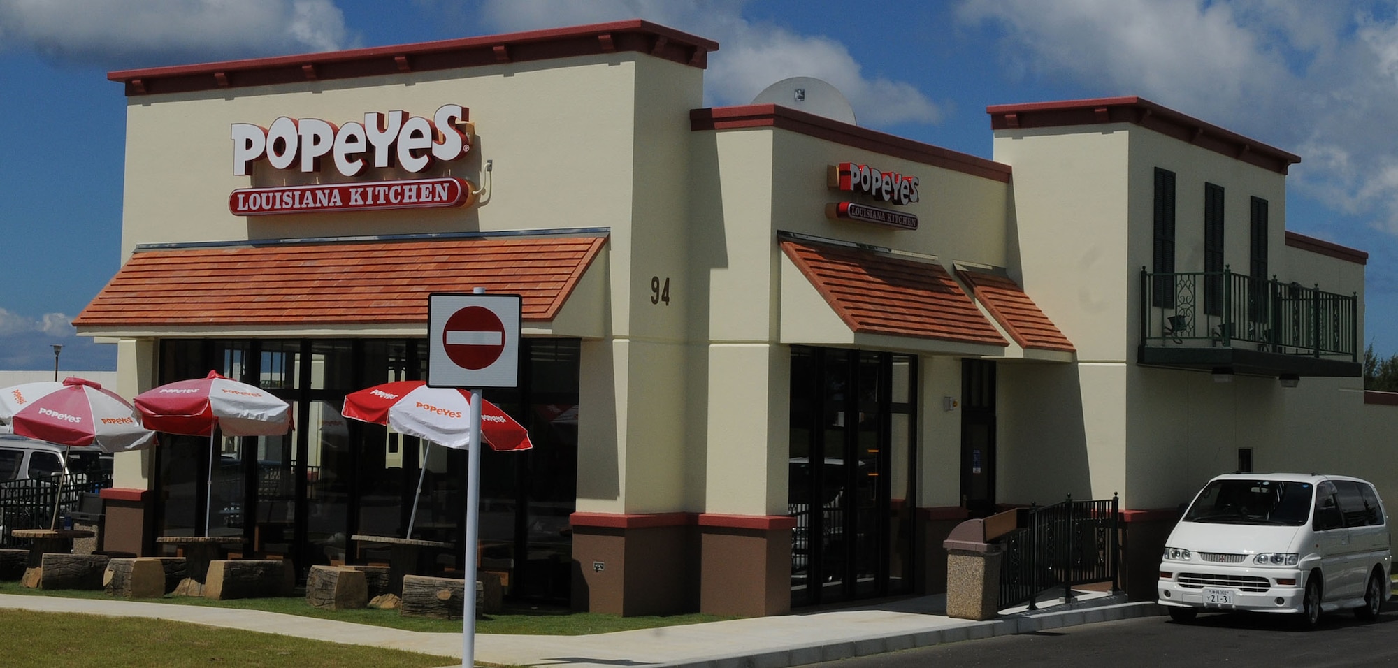 A van leaves the drive-thru of the new Popeyes restaurant on Kadena, Sept. 21, 2010. The new Popeyes opened this month across from the Olympic Shopping Mall replacing the one on Fairchild and Douglas. The old Popeyes location is slated to become a Pizza Hut/Wing Stop. (U.S. Air Force Photo by Tech. Sgt. Mike Tateishi)
