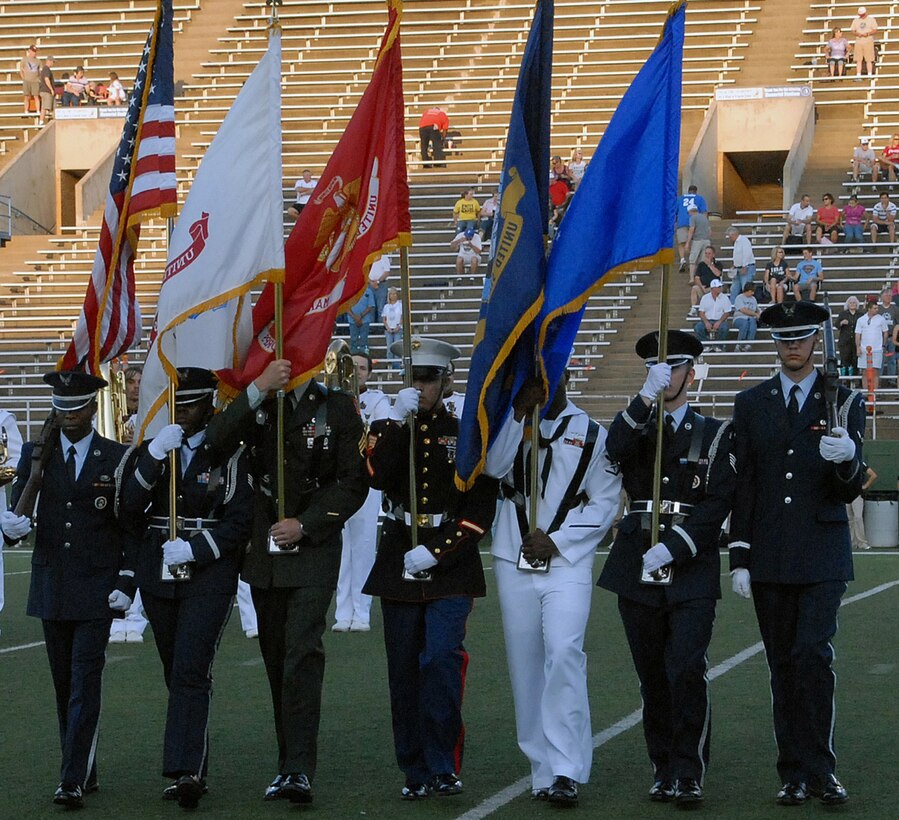 A multi-service color guard presented the colors during the opening ceremony of the annual MSU Military Appreciation Game at Memorial Stadium in Wichita Falls, Texas Sept. 18.  The game featured a T-38 flyover from Sheppard at the start of the game and halftime had a patriotic theme as MSU and military bands played together, 15 new recruits enlisted in the Air Force, a large American flag was brought onto the field and the attendees were treated to a fireworks show.  (U.S. Air Force photo/LouAnne Sledge)