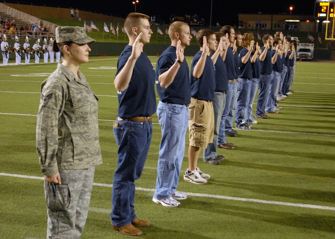 Fifteen Air Force recruits took the Oath of Enlistment during halftime at the annual Midwestern State University Military Appreciation Game at Memorial Stadium in Wichita Falls, Texas Sept. 18.  Halftime also featured a patriotic theme as MSU and military bands played together, a large American flag was brought onto the field and a fireworks show lit up the sky.  (U.S. Air Force photo/LouAnne Sledge)