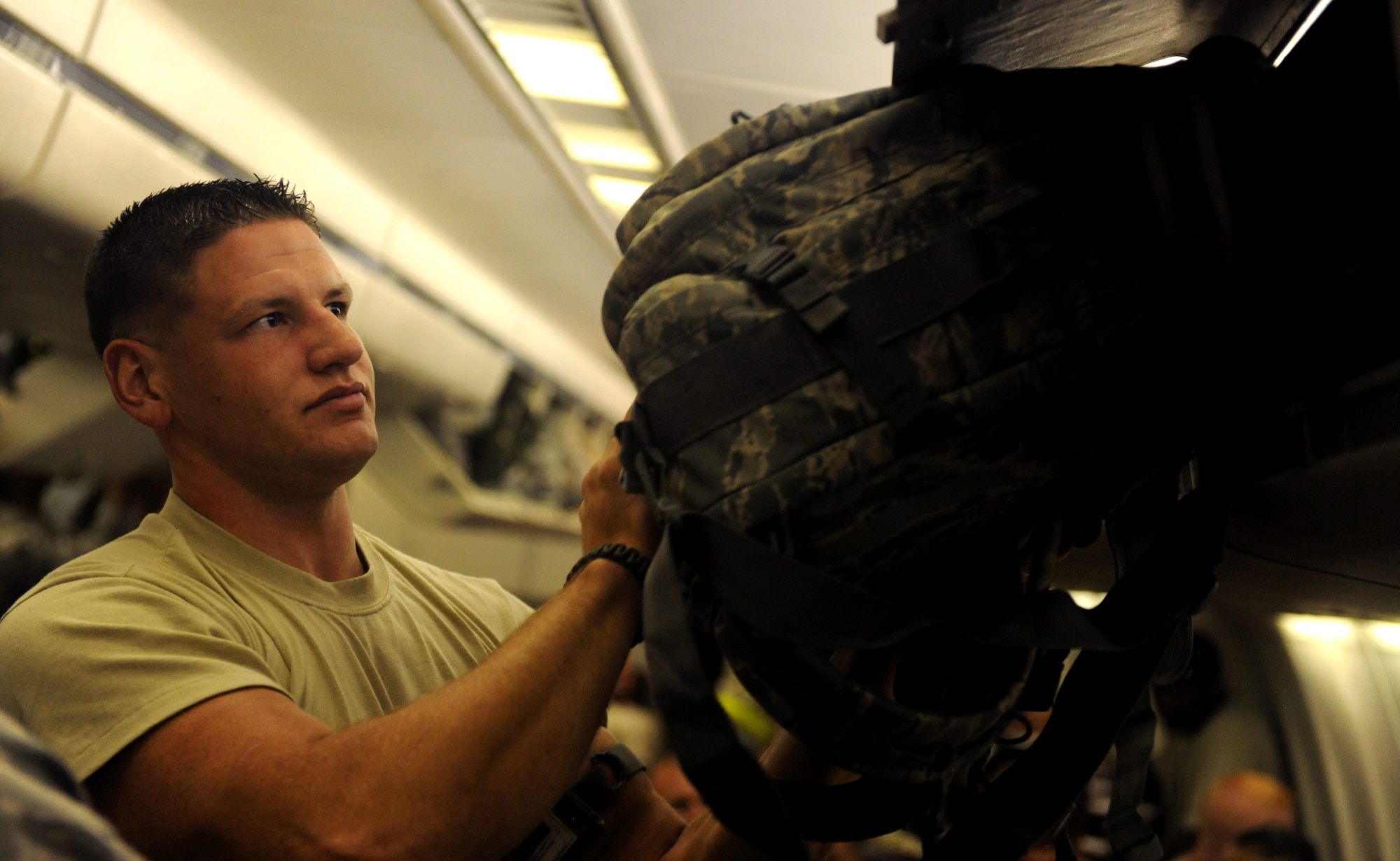 MOODY AIR FORCE BASE, Ga. -- Senior Airman William Beard, 23rd Aircraft Maintenance Squadron ammunitions loader, stuffs his bag into an overhead compartment here. Once all the personnel were on board, the aircraft departed to Afghanistan for deployment. (U.S. Air Force photo/Airman 1st Class Benjamin Wiseman)






