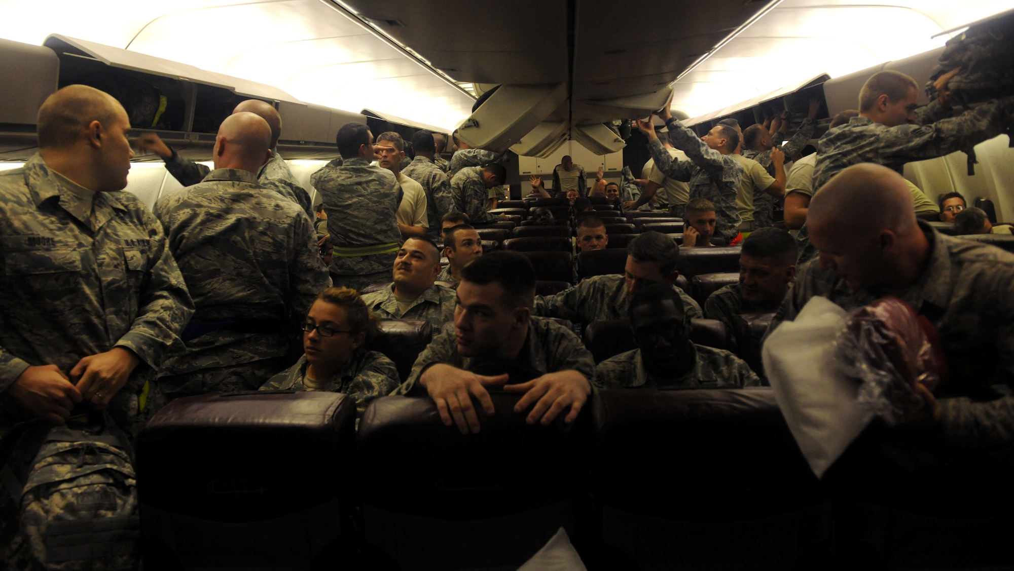 MOODY AIR FORCE BASE, Ga. -- Members from Moody start to take their seats on a commercial aircraft here. Moody personnel filled the entire aircraft before take-off. (U.S. Air Force photo/Airman 1st Class Benjamin Wiseman)






