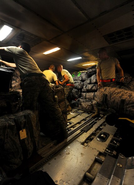 MOODY AIR FORCE BASE, Ga. -- Members from different squadrons around Moody load gear onto a commercial flight here. The members from the 23rd Aircraft Maintenance Unit loaded their own equipment before boarding the aircraft. (U.S. Air Force photo/Airman 1st Class Benjamin Wiseman)



