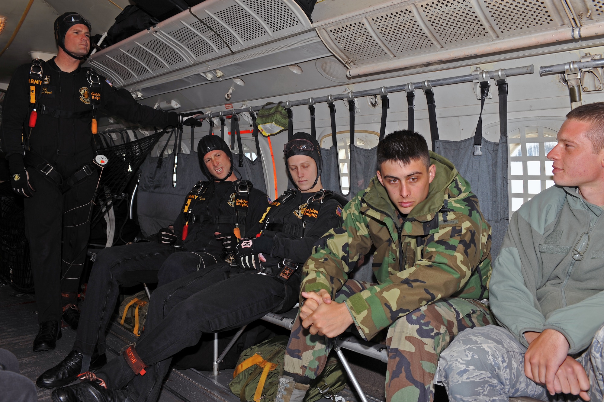 Airmen from the 509th Bomb Wing receive incentive flight with the U.S. Army Golden Knights Parachute Team, Sept. 18. Airmen from base organizations were selected to fly with the gold team during the Wings Over Whiteman Air Show and Open House. Incentive flights were offered at the wing level to servicemembers who distinguish themselves as outstanding performers.  (U.S. Air Force photo/Tech. Sgt. Charles Larkin Sr.)