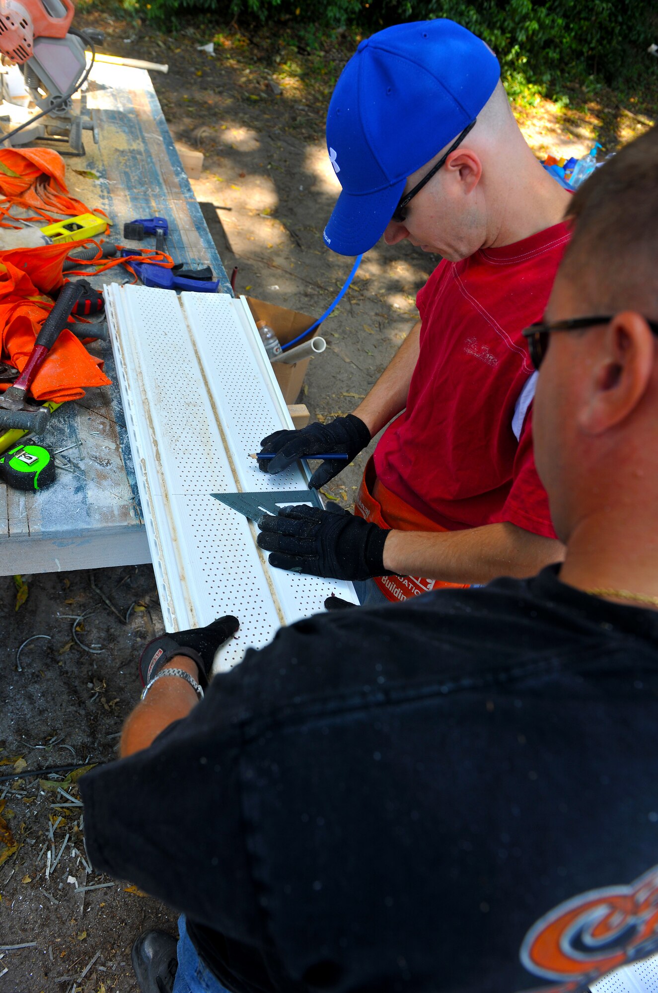 VALDOSTA, Ga. -- Tech. Sgt. Brian Ruthrauff, 23rd Communications Squadron NCO in-charge of wing information assurance, from Moody Air Force Base, Ga., measures a panel with a protractor tool during a Freedom Build project here Sept. 15. The panels are used to cover and protect certain parts of the house from animals and rain damage. (U.S. Air Force photo/Airman 1st Class Joshua Green)

