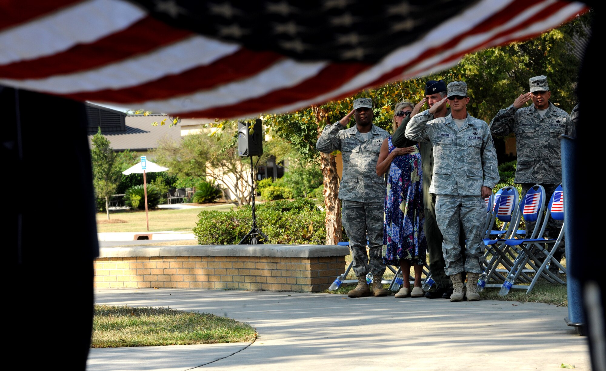 MOODY AIR FORCE BASE, Ga. -- Moody leadership from Moody renders a final salute during the Prisoner of War/Missing in Action Recognition Day Ceremony here Sept. 17. The Moody Honor Guard folded both the American flag and the POW/MIA flag during the ceremony. (U.S. Air Force photo/Airman 1st Class Benjamin Wiseman)
