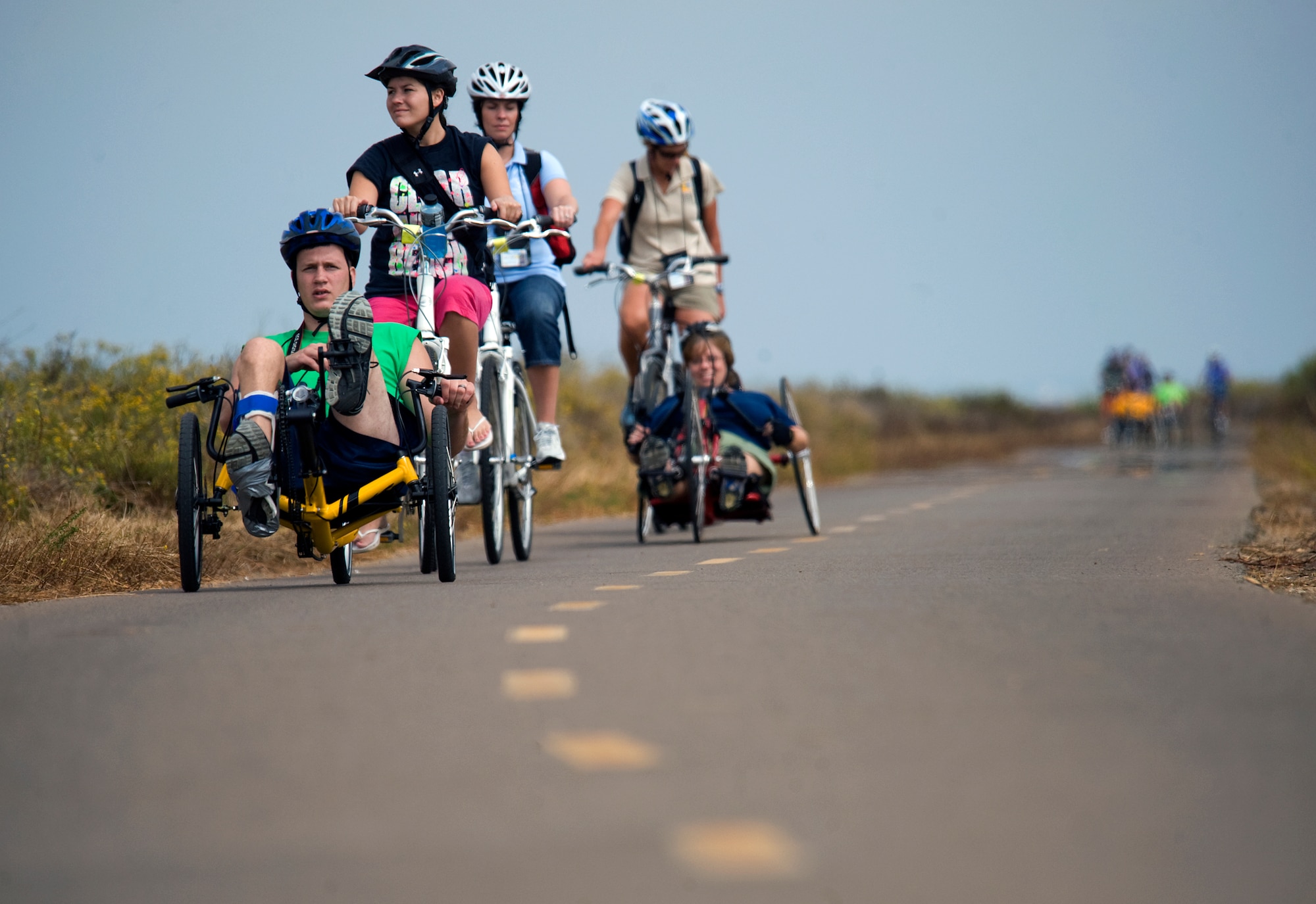 Disabled veterans from all branches of service take part in a cycling race along Silver Strand State Beach during the opening day of events for the 2010 National Veterans Summer Sports Clinic Sept. 20, 2010, San Diego, Calif. Participation is open to U.S. military service veterans with orthopedic amputations, traumatic brain injuries, burn injuries, psychological trauma, certain neurological conditions, visual impairment, spinal cord injuries and other recently incurred disabilities. (U.S. Air Force photo/Tech. Sgt. Bennie J. Davis III)