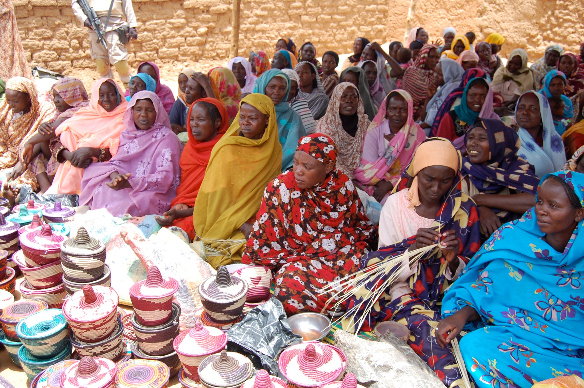 The women of the Abu Shouk IDP camp came out to celebrate receiving Solar Cookers donated by Maj. Jonathan Gration. The Solar Cookers cut the requirement for firewood by two-thirds. It also keeps the women from having to search for firewood outside of the IDP camp where they are at risk for attack. It also preserves Darfur’s trees; Sudan currently ranks fourth in the world for deforestation. (Courtesy Photo)