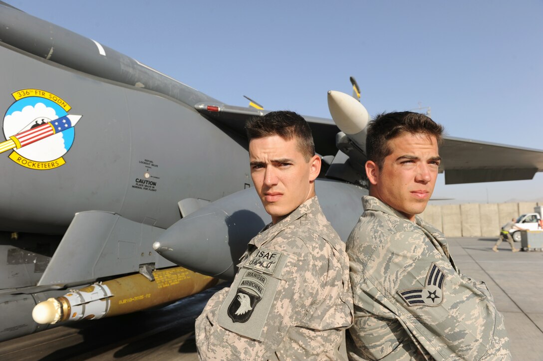 Army Staff Sgt. Jonathan Cole (left) and Senior Airman William Cole stand in front of an F-15E Strike Eagle at Bagram Airfield, Afghanistan. Sergeant Cole is a member of the 101st Airborne Division and Airman Cole is assigned to the 336th Aircraft Maintenance Unit at Bagram Airfield. (U.S. Air Force photo/Tech. Sgt. Drew Nystrom)