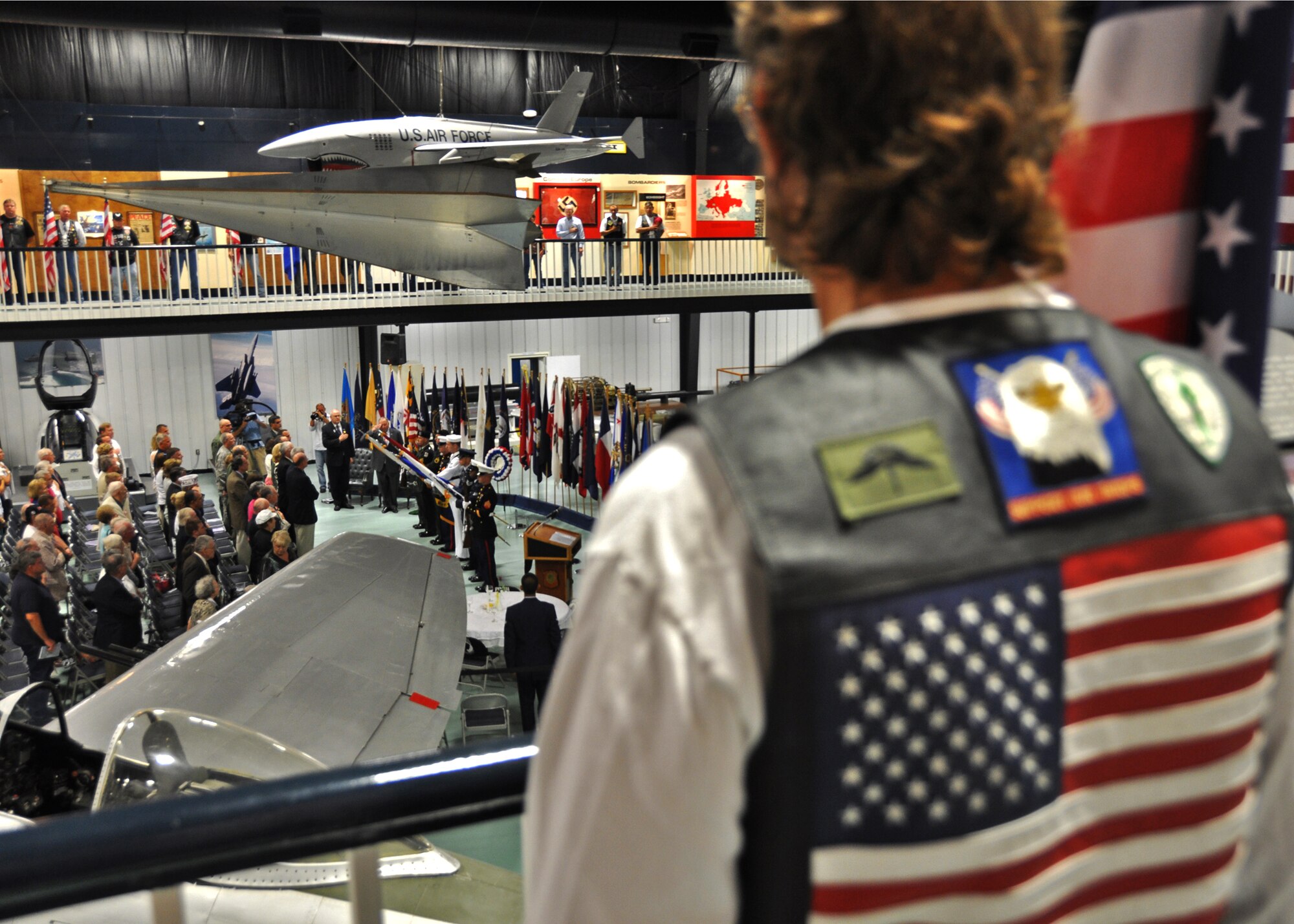 A member of the Patriot Guard watches as the flag is presented during the National Anthem at the POW/MIA ceremony Sept. 17 at the Air Armament Museum.  The ceremony paid tribute to those military members who have yet to return home from defending America.  The event was hosted by the 96th Air Base Wing and featured guest speakers, honor guard procedures and a flyover by the 46th Test Wing.  (U.S. Air Force photo/Samuel King Jr.)
