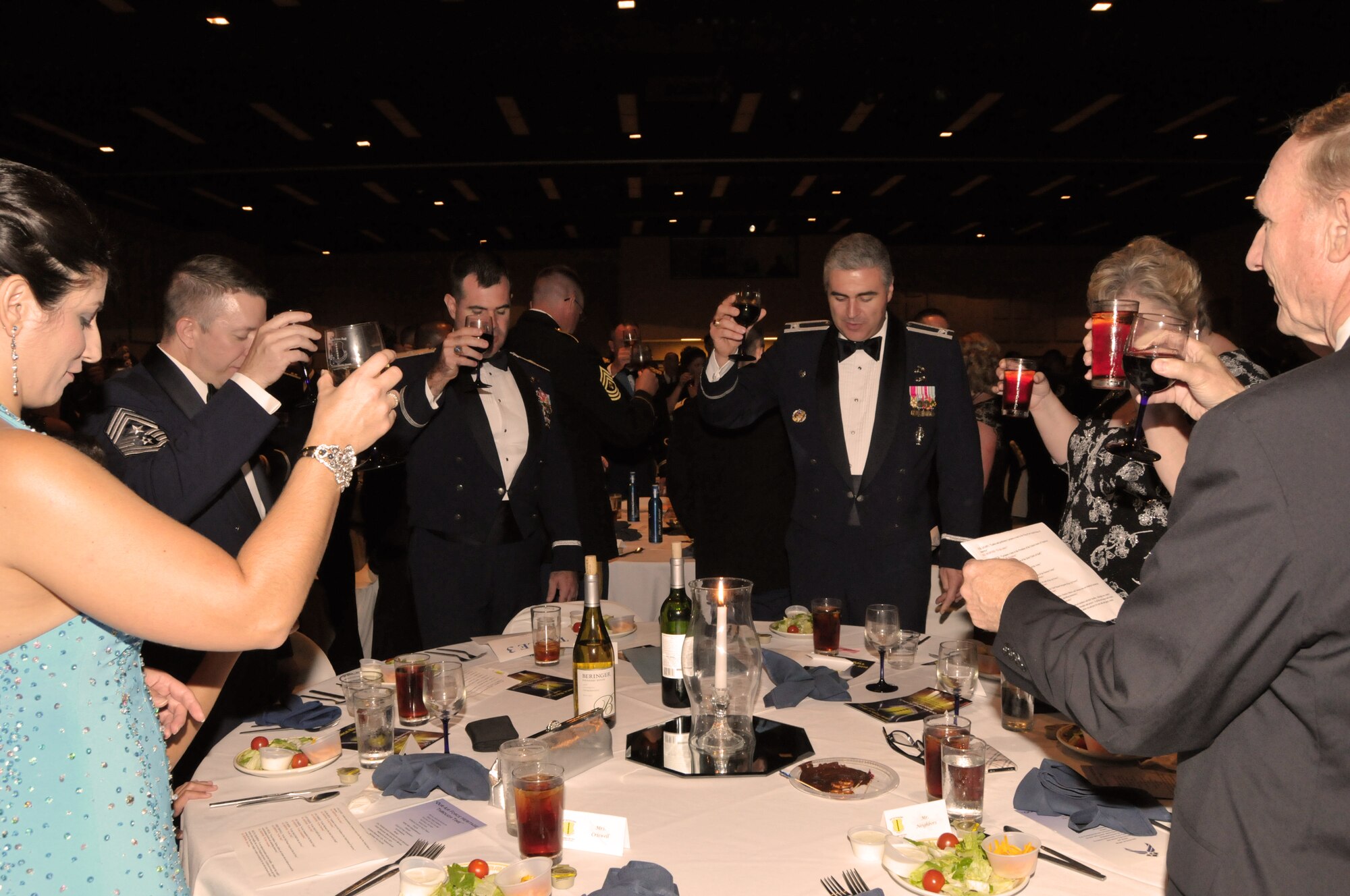 GOODFELLOW AIR FORCE BASE, Texas – Members at the head table give a toast as a gesture of honor to the Colors, President of the United States, Chief of Staff of the Air Force and sister services, and servicemembers deployed “defending freedom and upholding democracy,” during the 63rd Annual Air Force Ball Sept. 17. (U.S. Air Force photo/ Senior Airman Tong Duong)