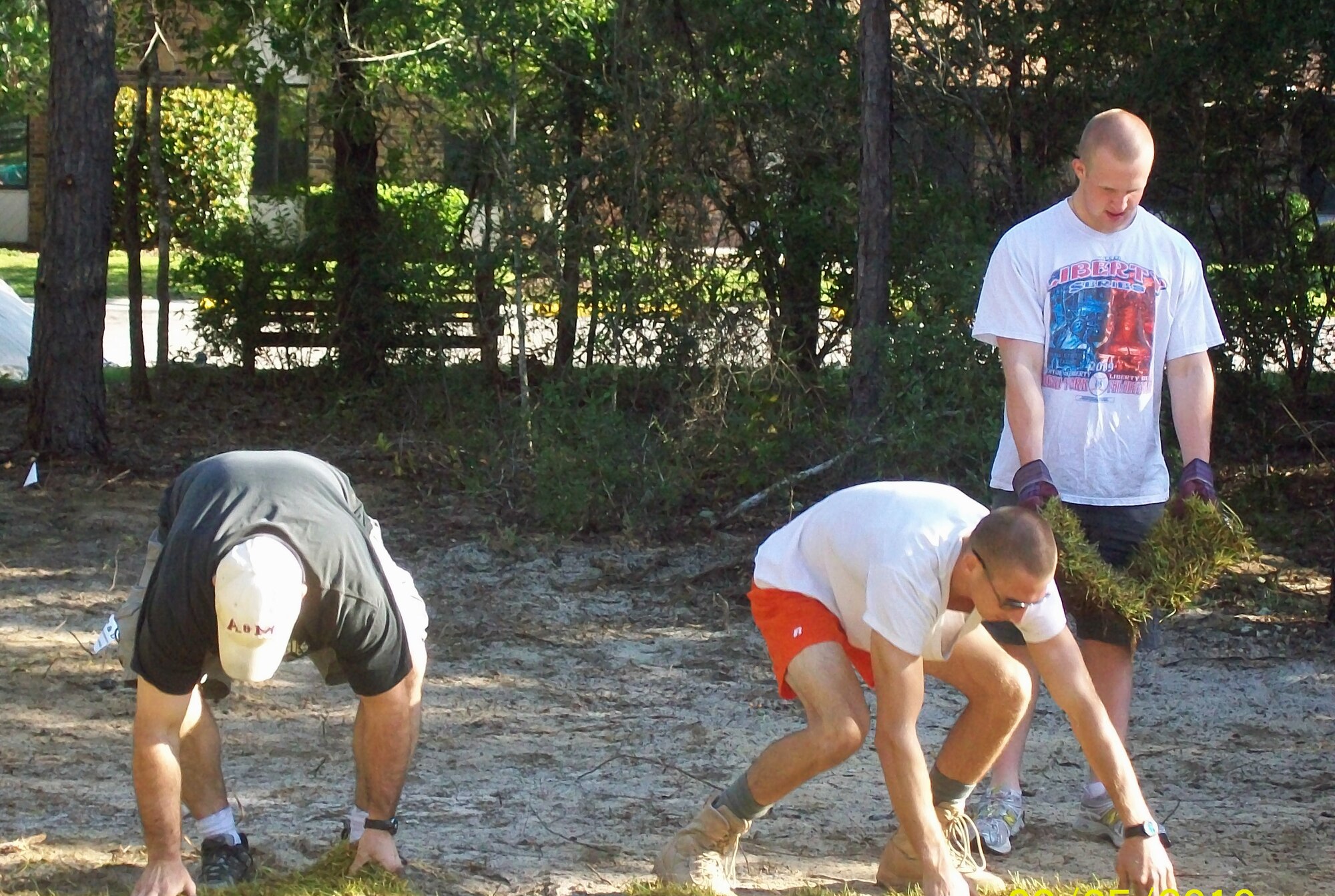 Three Tactical Air Control Party Airmen from Hurlburt Field, Fla., work together to help build the new park Sept. 5, 2010 at the Air Force Enlisted Village at Shalimar, Fla. (Courtsey photo) 