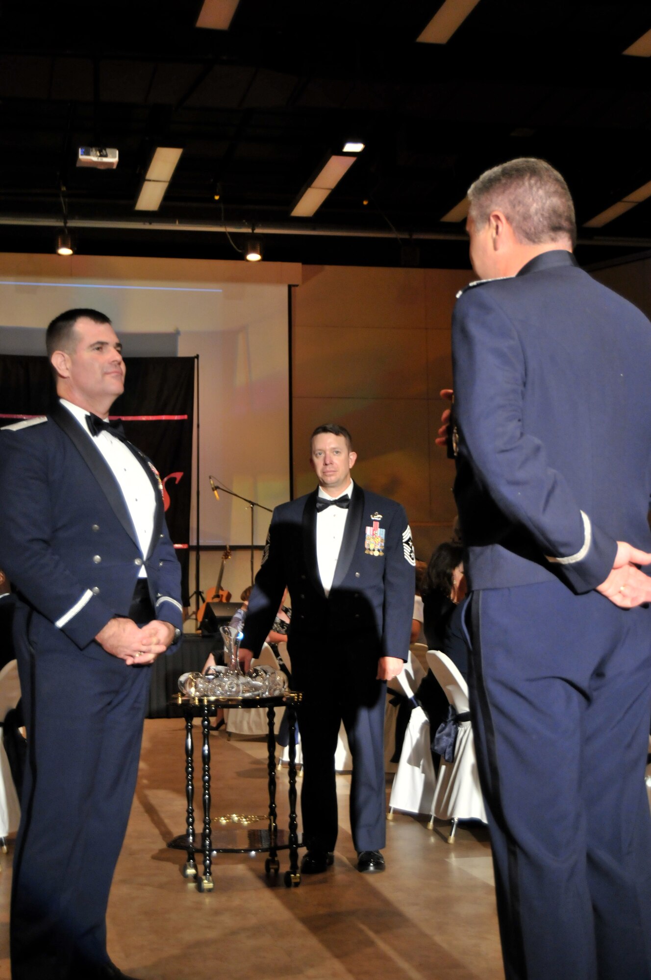 GOODFELLOW AIR FORCE BASE, Texas – 17th Training Wing commander, Col. Thomas Geary (right) and Chief Master Sgt. Brendan Criswell, 17 TRW command chief (middle) present guest speaker, Brig. Gen. Scott Bethel (left) with a token of appreciation from the men and women of the 17 TRW, during the 63rd Annual Goodfellow Air Force Ball, Sept. 17. General Bethel is the Director, Strategy, Integration and Doctrine, Deputy Chief of Staff for Intelligence, Surveillance and Reconnaissance, Headquarters U.S. Air Force, Washington, D.C., and was a wing commander here, 2005-2007. (U.S. Air Force photo/ Senior Airman Tong Duong)