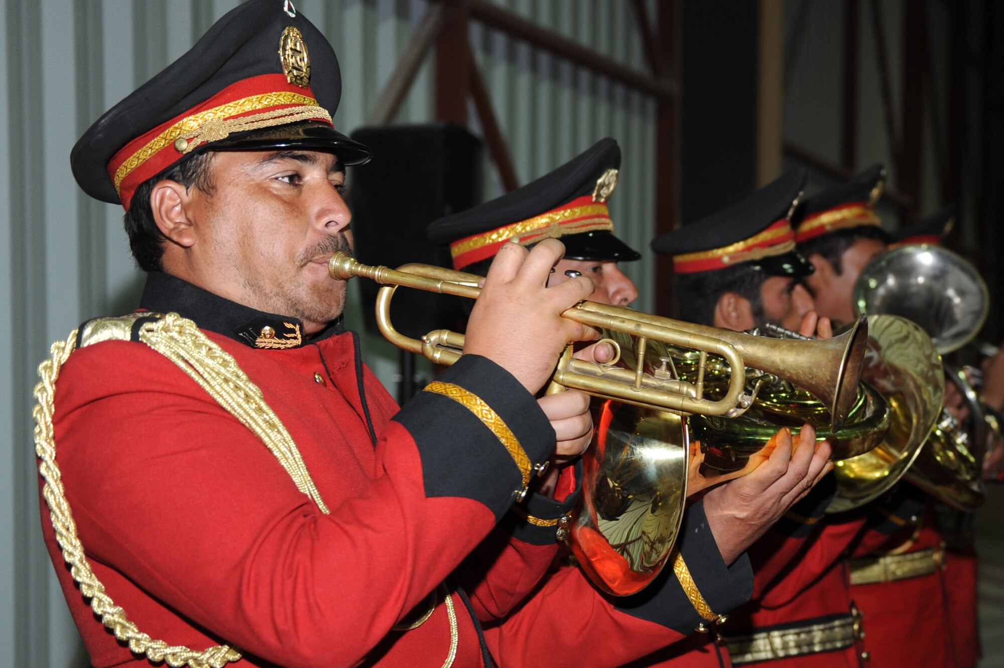 A member of an Afghan ceremonial band plays the trumpet during the U.S. Air Force’s 63rd birthday celebration, Sept. 19, 2010, at Kandahar Airfield, Afghanistan.  The Kandahar Air Wing hosted Airmen from the 451st Air Expeditionary Wing and the 738th Air Expeditionary Advisory Group for a traditional meal and social event to commemorate the establishment of the U.S. Air Force. (U.S. Air Force photo by Tech. Sgt. Chad Chisholm/Released)