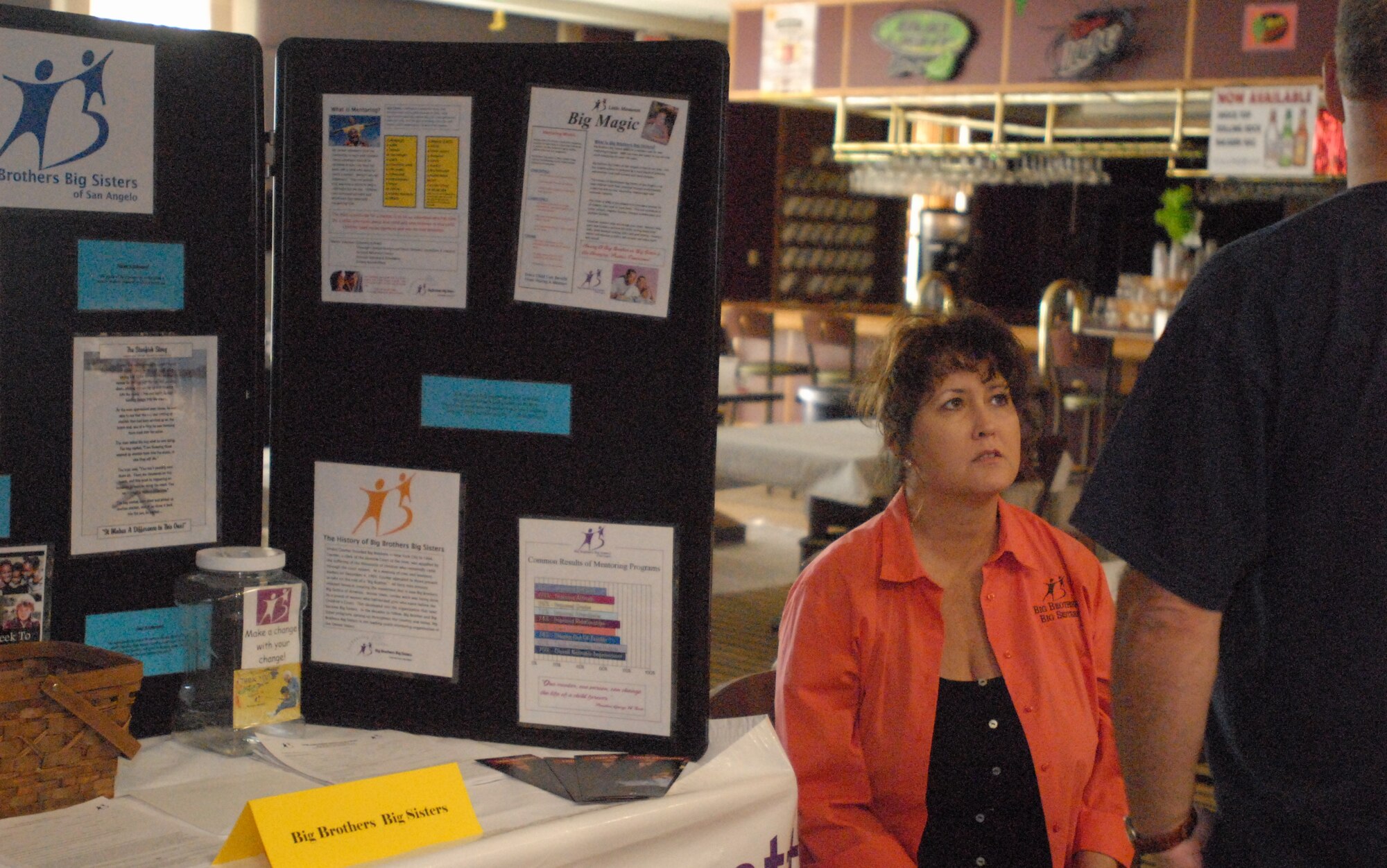 Lisa Nichols, Big Brothers/Big Sisters regional executive director, talks about how Big Brothers/Big Sisters can how help parents with special needs children during the first-ever family fun and information fair at the Event Center Sept. 18. Various agencies throughout the base and San Angelo community came together offering information while crafts and activities were held for the children. (U.S. Air Force photo/Connie Hempel)