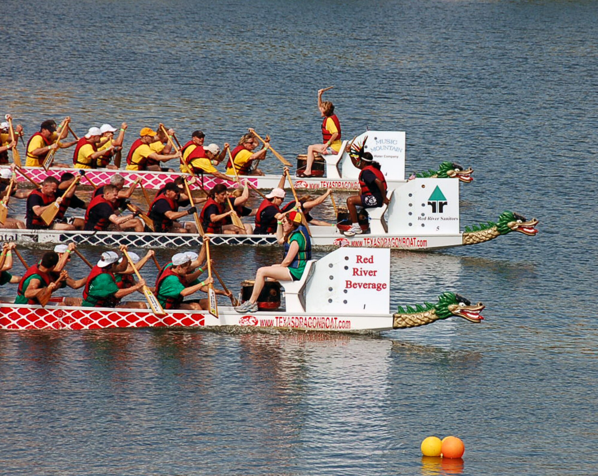 SHREVEPORT, La. – The Eighth Air Force dragon boat team (middle) came in a close second in their third race of the day Sept. 11. The team competed against 26 other teams during the 2nd Annual Red River Dragon Boat Festival held at the River View Park in Shreveport, La. The races feature 41-foot-long dragon boats that hold 21 team members, Eighth Air Force finished fourth in the race. (U.S. Air Force photo by Staff Sgt. Brian Stives)