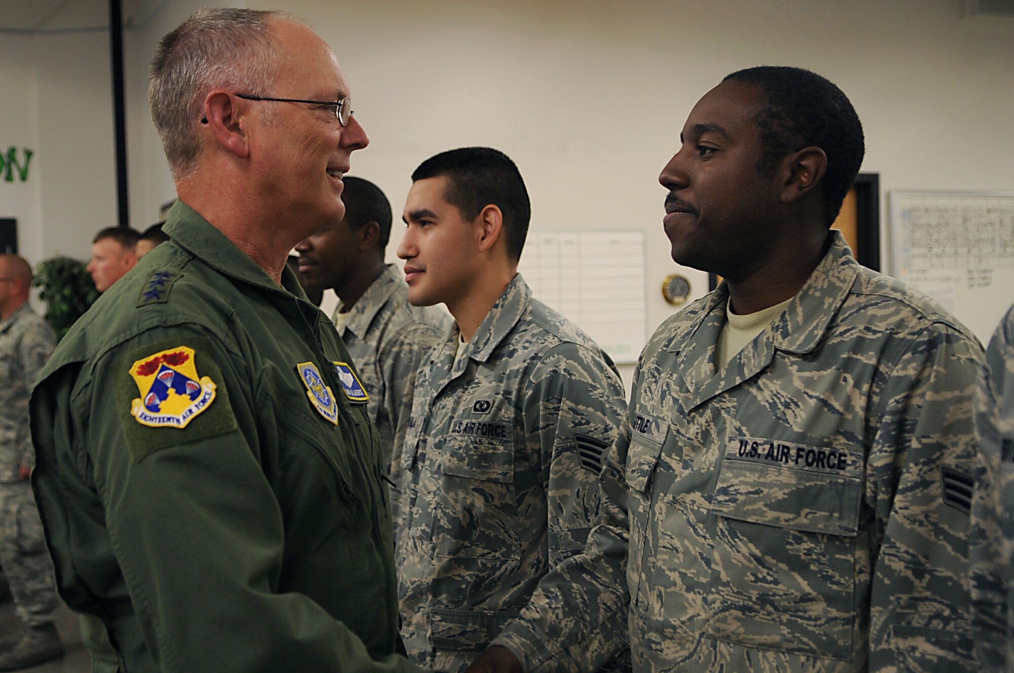Lt. Gen. Robert Allardice, 18th Air Force commander, greets Senior Airman Michael Little, 319th Operations Support Squadron, Sept. 16-17 during a visit to Grand Forks Air Base. General Allardice’s visited to witness firsthand the air refueling mission before the transition to an Unmanned Aerial Systems mission. (U.S. Air Force photo by Senior Airman Amanda N. Stencil)