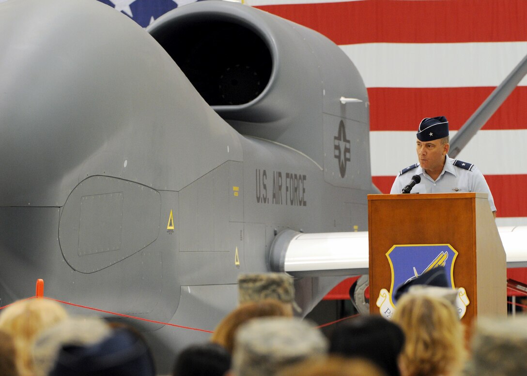 Brig. Gen. John Doucette addresses the audience during the Global Hawk arrival ceremony Sept. 20, 2010, at Andersen Air Force Base, Guam. The Global Hawk's mission is to provide a broad spectrum of ISR collection capability to support joint combatant forces in worldwide peacetime, contingency and wartime operations. The Global Hawk is operated by the 12th Reconnaissance Squadron at Beale AFB, Calif. General Doucette is the 36th Wing commander. (U.S. Air Force photo/Senior Airman Nichelle Anderson)