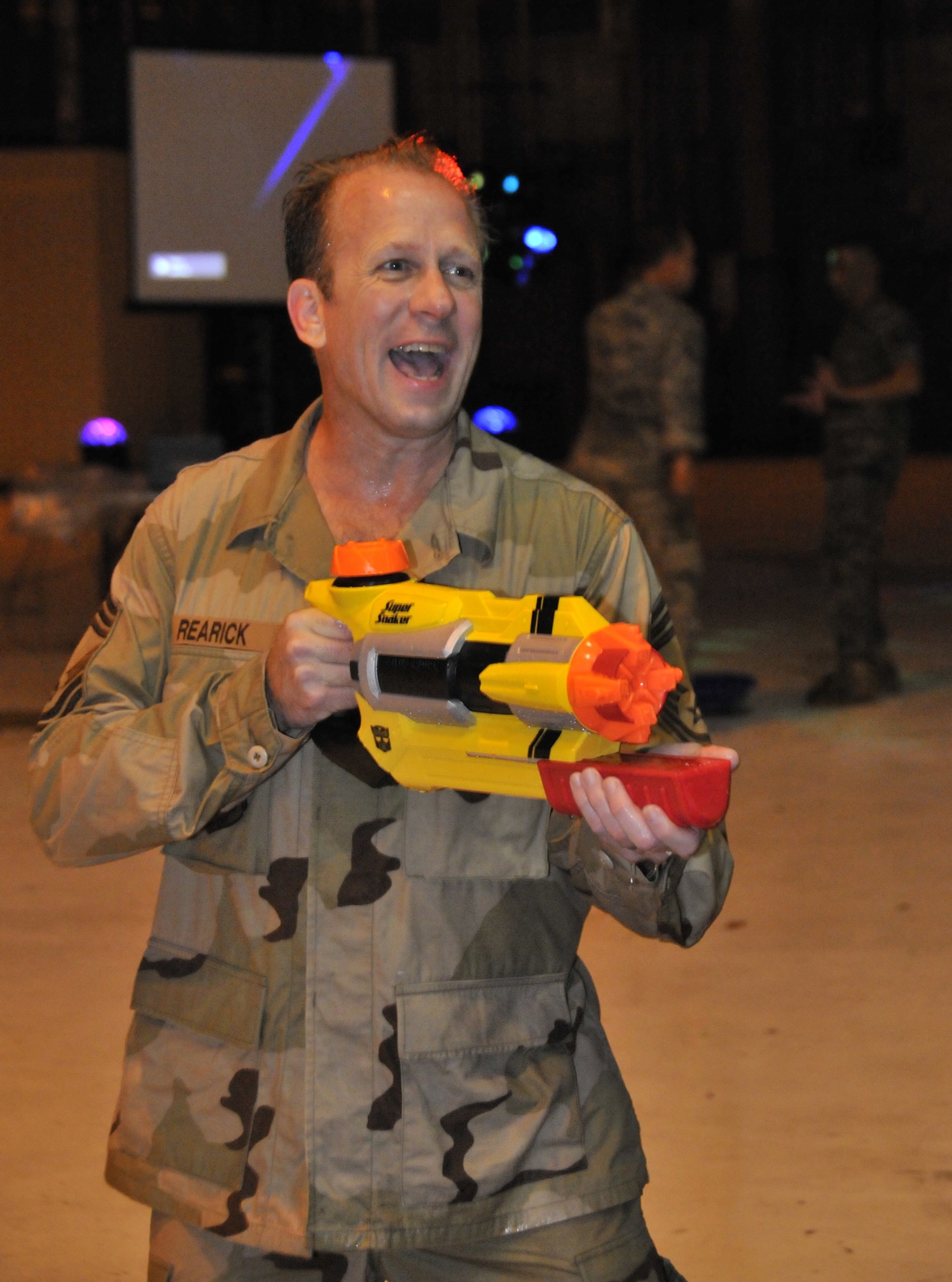 WRIGHT-PATTERSON AIR FORCE BASE, Ohio – Chief Master Sgt. Ronald Rearick, 445th Civil Engineer Squadron, takes part in a water gun fight during the Sept. 11 Wright-Patterson Air Force Base Enlisted Combat Dining-In. (U.S. Air Force photo/Master Sgt. John Koehl)