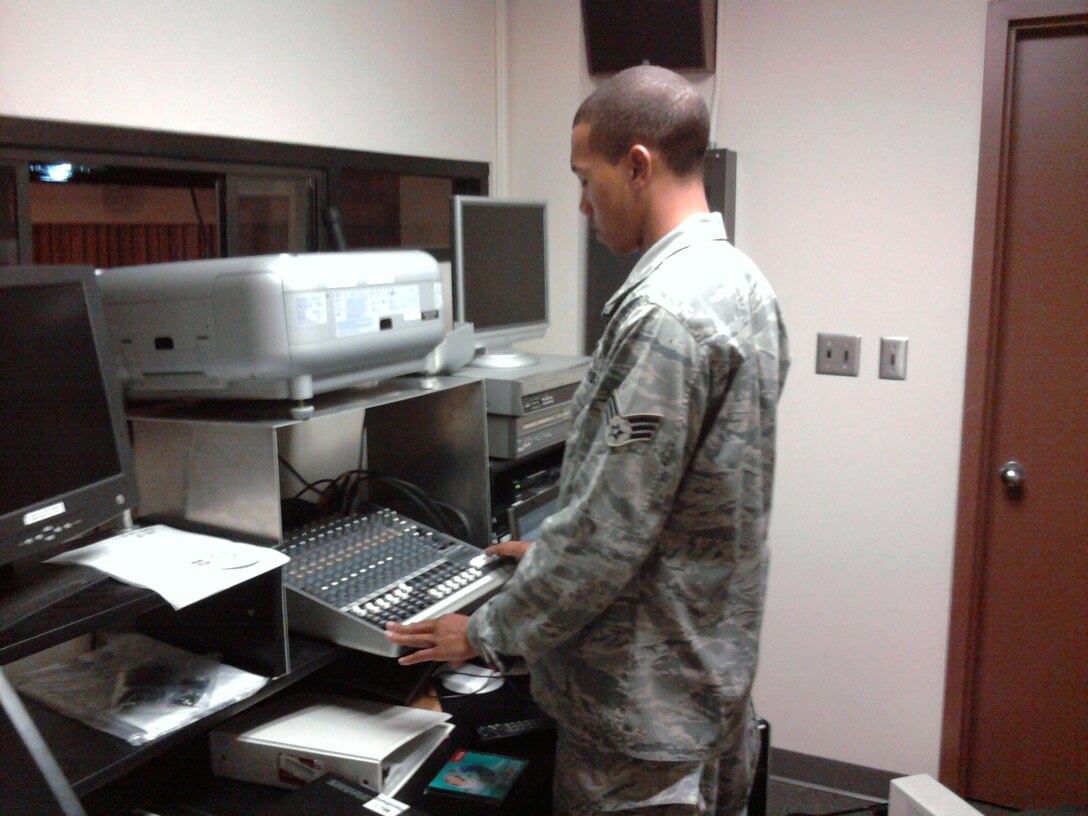 Senior Airman Christopher Twitty sound checks microphones prior to a commander's call at Tyndall Air Force Base, Fla. Airman Twitty is a reservist with the 916th Communication Squadron and deployed to Tyndall till the end of the year. (USAF photo courtesy of 916CS)
