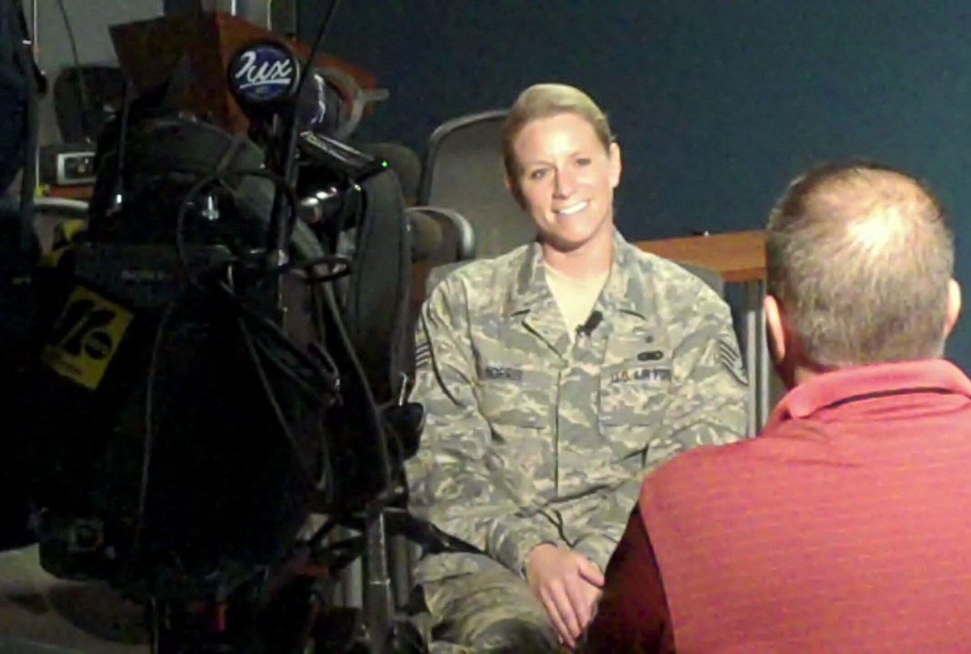 Staff Sgt. Michele Norris discusses with Mark Falgout, WTVD-ABC11 news producer, her experiences as a Gold Star Mother.(USAF photo by Staff Sgt. Terrica Y. Jones 916 ARW/PA)