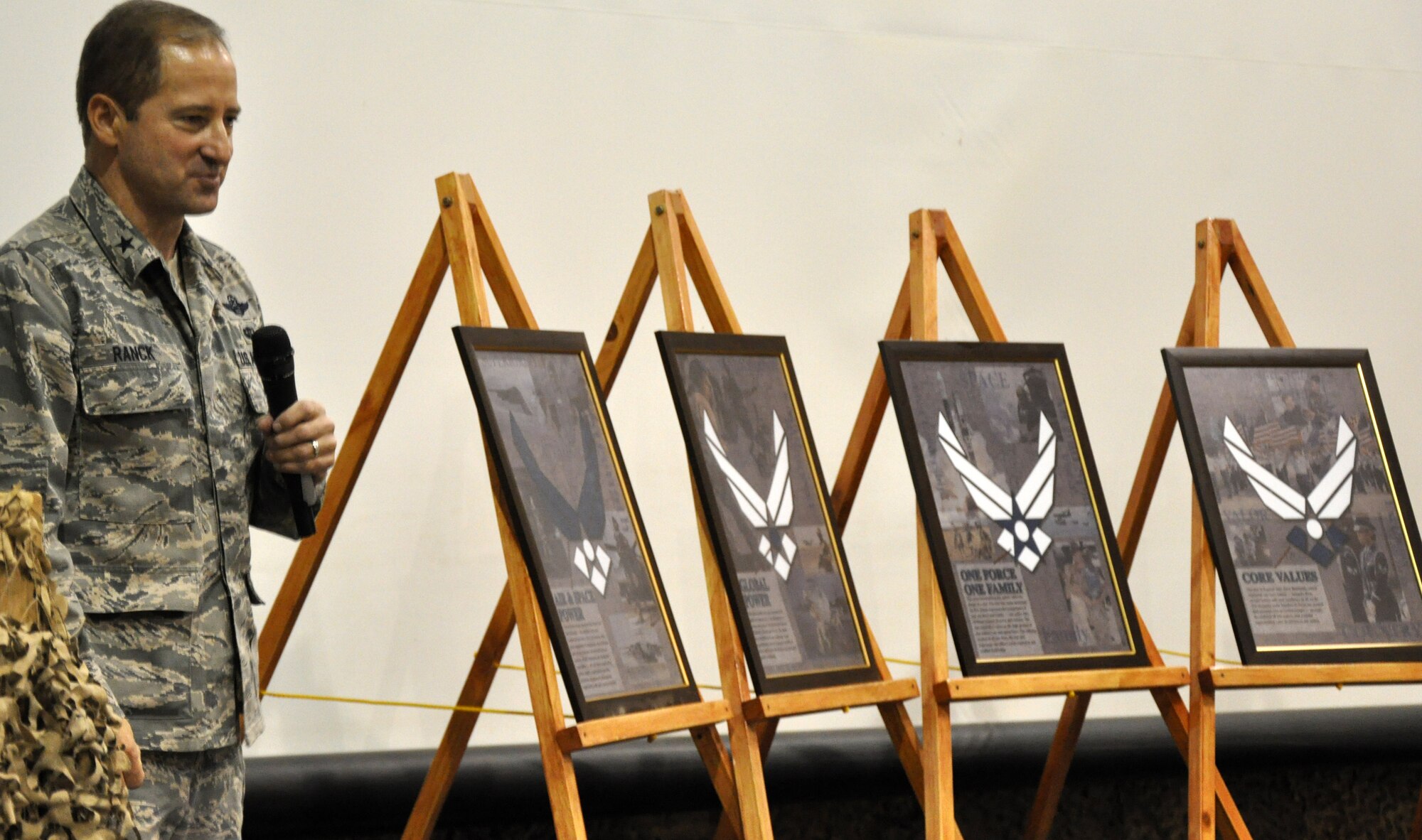 Brig. Gen. John Rank, Deputy Director of J9 and Strategic Effects, addresses attendees during a ceremony for the Air Force's 63rd birthday celebration.  More than 200 Army and Air Force servcicemembers were present for the ceremony along with a delegation from the Iraqi Air Force.  (U.S. Air Force photo by Tech. Sgt. Mike Edwards)