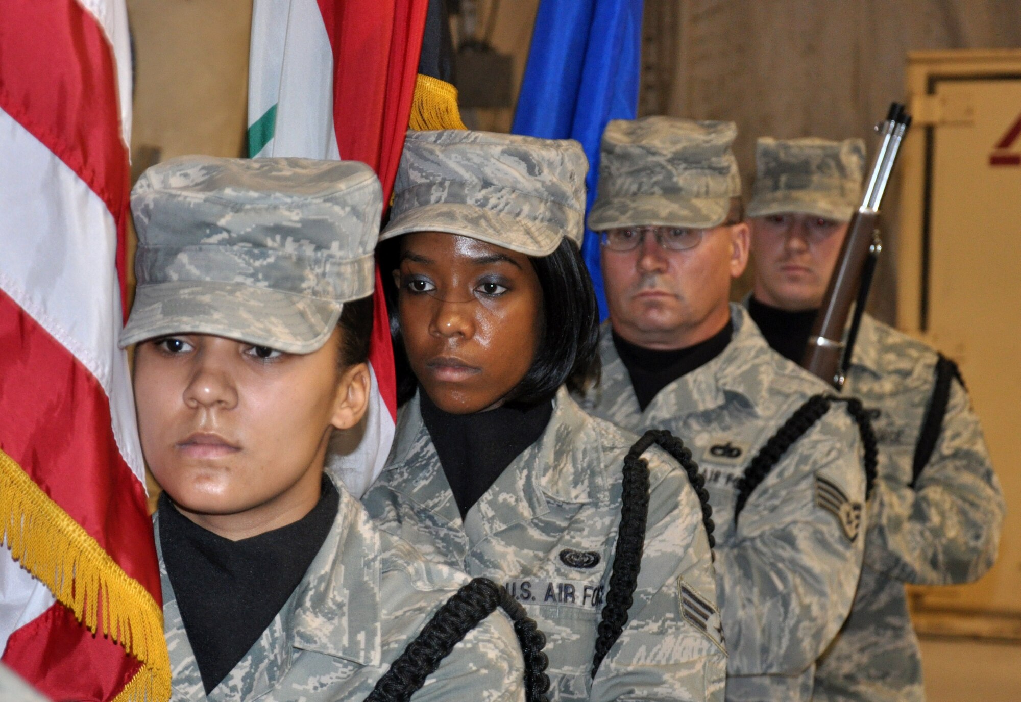 Members of the Sather Air Base Honor Guard depart after presenting the colors during the opening ceremony for the Air Force's 63rd birthday celebration.  More than 200 Army and Air Force servcicemembers attended the ceremony along with a delegation from the Iraqi Air Force.  (U.S. Air Force photo by Tech. Sgt. Mike Edwards)