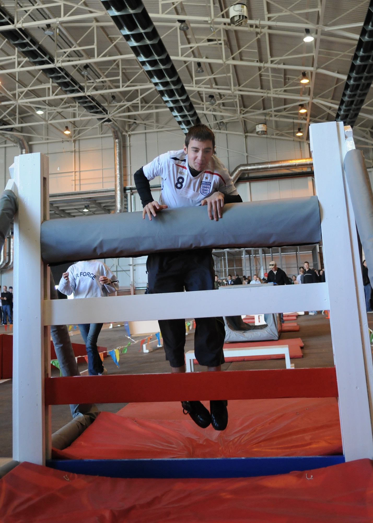 RAF MILDENHALL, England -- A Joan Mann Special Sports Day participant competes in the obstacle course at Hangar 711 Sept. 18. Special-needs athletes from across East Anglia traveled to RAF Mildenhall for the friendly competition that is held annually. Joan Mann, a former Ministry of Defence employee working in the public affairs office here, started the event 29  years ago. (U.S. Air Force photo/Staff Sgt. Thomas Trower) 