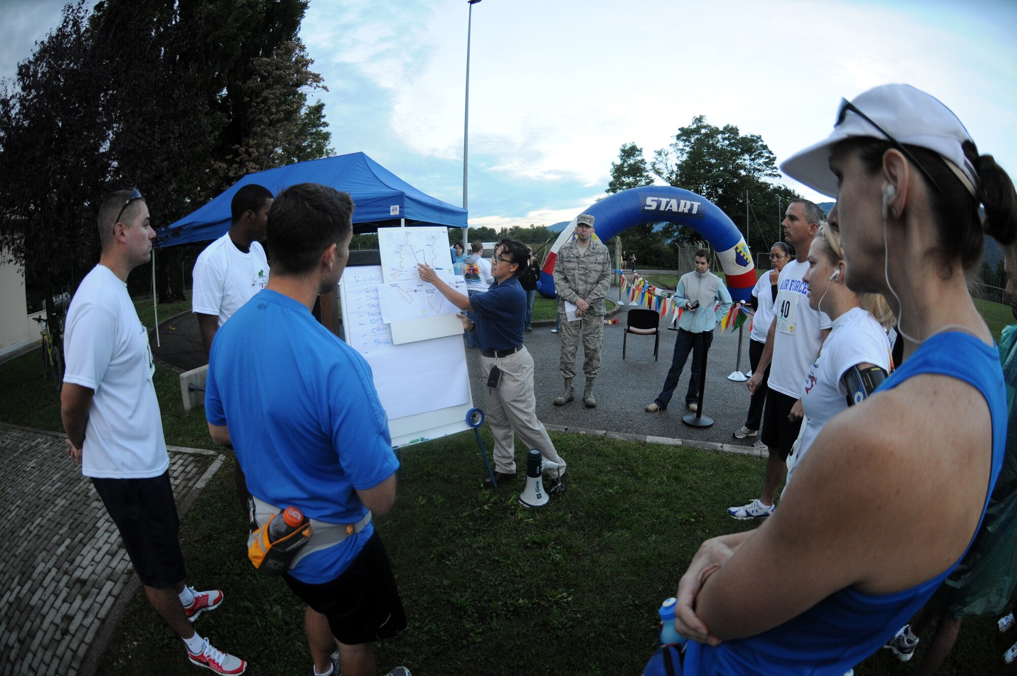 Tanya McCormick, 31st Force Support Squadron fitness center director, shows the route to participants of the fourth annual Aviano Marathon Sept. 19. (U.S. Air Force photo/Staff Sgt. Julius Delos Reyes)