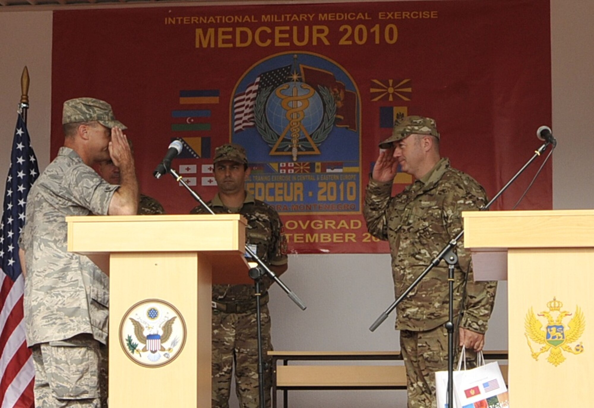 Lt. Col. Jeff White, Expeditionary Medical Support commander at MEDCEUR 2010, a medical training exercise in central and eastern Europe, normally assigned to the 48th Medical Group at RAF Lakenheath, England, (left), and Chief of Staff of the Montenegrin armed forces, Col. Zoran Lazarevic, salute one another during an exchange of certificates during the closing ceremony for MEDCEUR 10 at Danilovgrad Army Base, Montenegro, Sept. 20. With MEDCEUR 10 wrapped up, MEDCEUR 2011 is already on the horizons with Macedonia as host nation. For more information go to www.usafe.af.mil/medceur.asp and www.odbrana.gov.me. (U.S. Air Force photo/Airman 1st Class Tiffany M. Deuel)