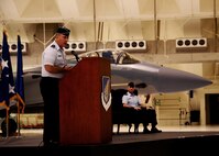 ANDERSEN AIR FORCE BASE, Guam ? Detachment 3 commander Col. Brandon Baker looks on as 36th Wing commander Brig. Gen. John Doucette addresses  attendees  of the Global Hawk arrival ceremony, here Sep. 20, The ceremony marked the arrival of the unmanned aerial vehicle to its new home on Andersen; it will provide far reaching reconnaissance capabilities in the pacific region. (U.S. Air Force photo by Airman First Class Jeffrey Schultze/released)
