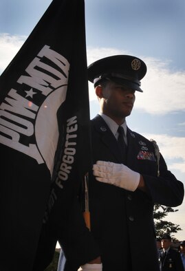 Staff Sgt. Tyron Jones, 51st Operations Support Squadron, carries the POW/MIA flag Sept. 17. National POW/MIA Recognition Day is annually observed in the United States on the third Friday of September. Osan Air base held observances and ceremonies for the entire week leading up to the national observance. (U.S. Air Force photo/Senior Airman Evelyn Chavez) 