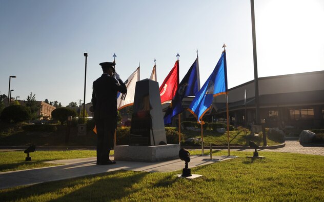 An honor guard member salutes the POW/MIA memorial at Osan Air Base Sept. 16. National POW/MIA Recognition Day is annually observed in the United States on the third Friday of September. The base held observances and ceremonies for the entire week leading up to the national observance. (U.S. Air Force photo/Senior Airman Evelyn Chavez) 