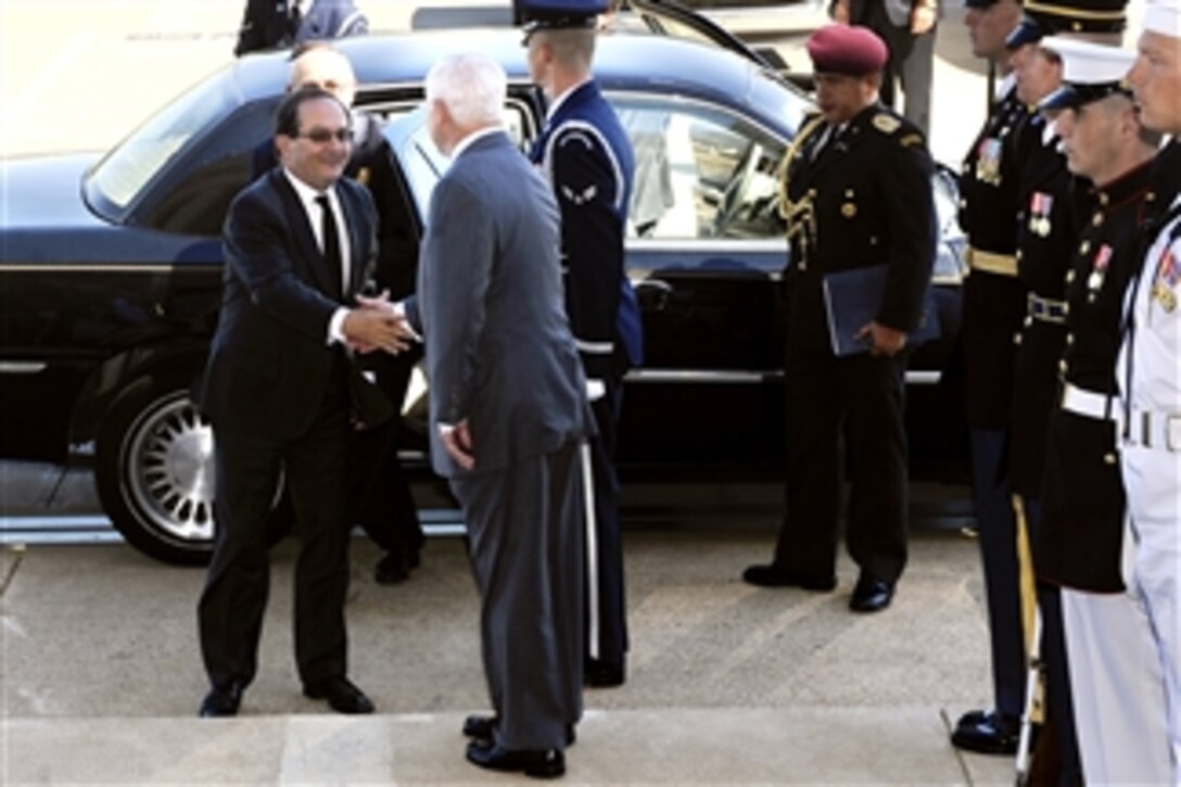 Secretary of Defense Robert M. Gates greets Ecuadorian Defense Minister Javier Ponce Cevallos at the Pentagon on Sept. 20, 2010.  