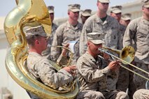 Cpl. Miller & Sgt. Sabo with the 1st Marine Division band (Forward), perform during a Colors & Memorial Dedication ceremony held at Camp Leatherneck, Afghanistan meant to honor fallen heroes.
