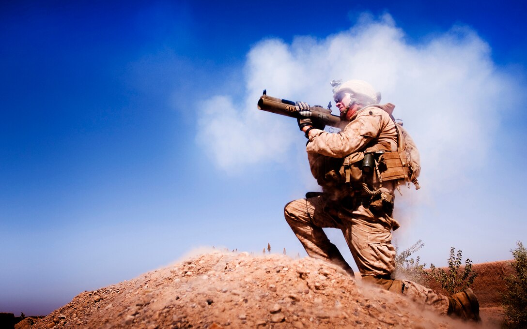 Gunnery Sgt. Chris Denham, the company gunny for India Company, 3rd Battalion, 3rd Marine Regiment, watches as the rocket from his light anti-tank weapon closes in on a compound used by enemy fighters during a firefight in Trek Nawa, Afghanistan, while participating in Operation Mako, Sept. 21, 2010. “The only thing louder than the back blast of the rocket was the Marines cheering,” said Capt. Francisco X. Zavala, the India Company commander. Mako was a one-day clearing mission to disrupt enemy activity. Denham is from Millbrook, Ala.