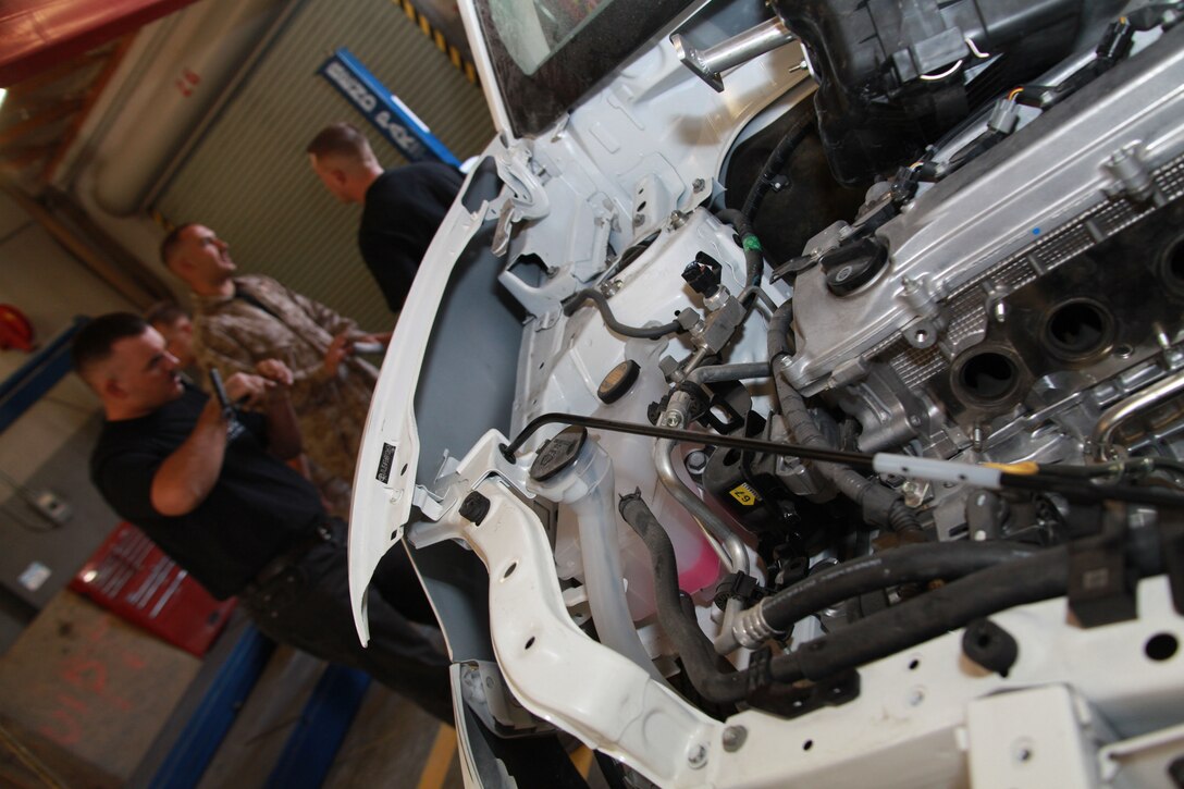Members of Kai Hei Tai, the Combat Center's Scion Battle of the Builds team, talk about upcoming modifications to their Scion xB. The final product will be an off-road xB "Assault," which is due to judges Oct. 5.