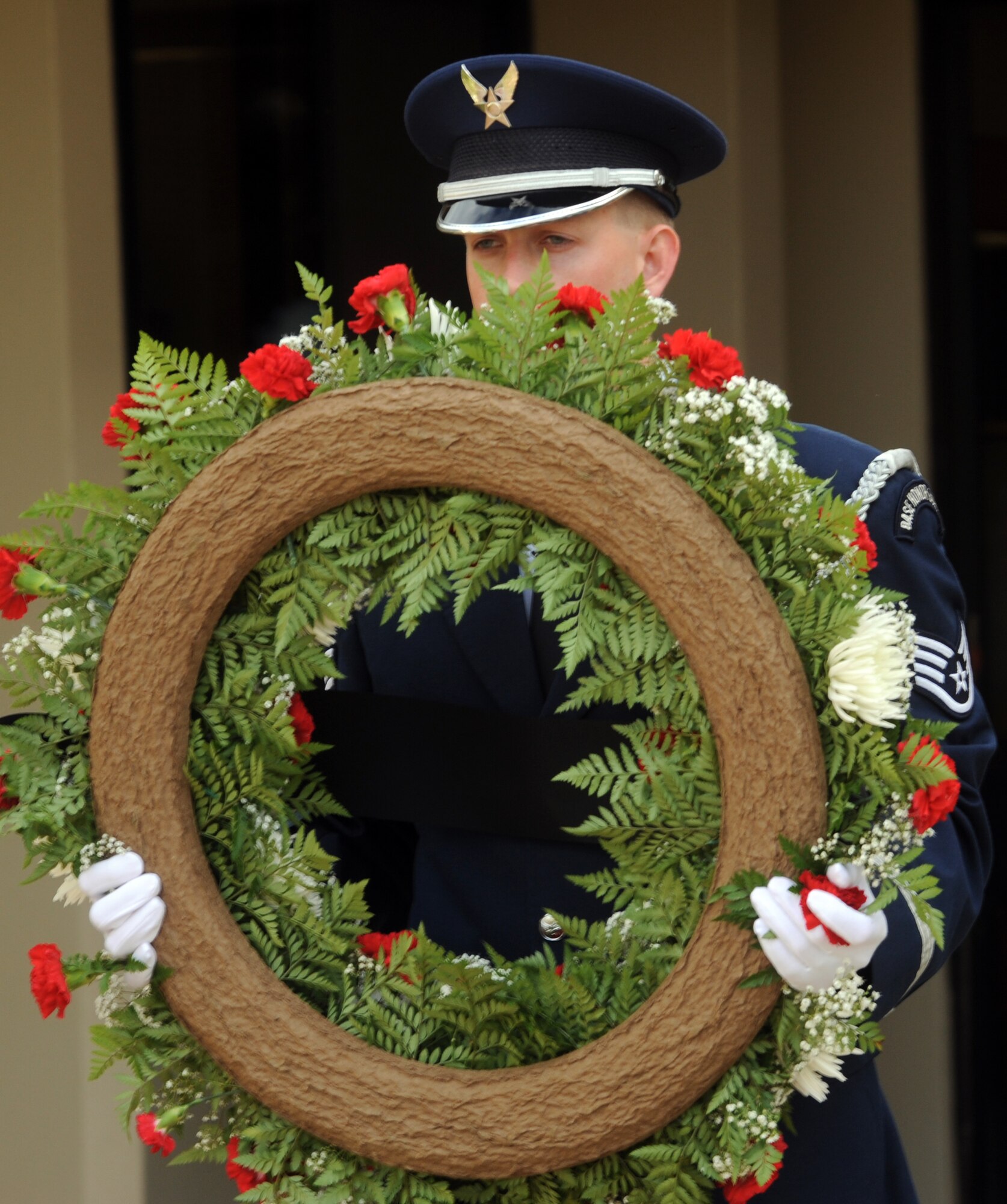 A Joint Base Pearl Harbor-Hickam honor guardsman lays a wreath during a reveille ceremony Sept. 17 to honor those 81,864 who are prisoners of war or missing in action. The reveille, wreath-laying ceremony, and a 24-hour relay were organized by the Air Force Sergeants Association. (U.S. Air Force photo/Staff Sgt. Carolyn Viss)