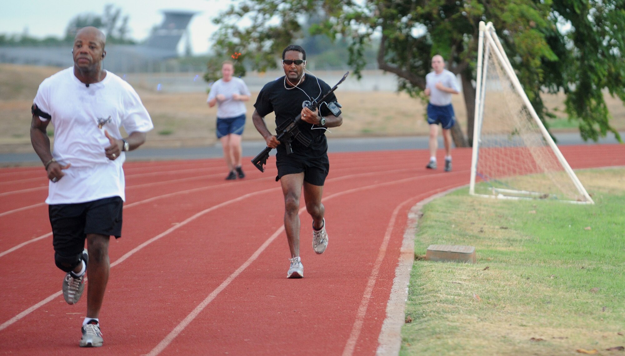 Major Sean Monteiro, 25th Air Support Operations Squadron assistant director of operations, runs with a rifle and POW/MIA flag during the POW/MIA 24-hour relay Sept. 16 at Joint Base Pearl Harbor-Hickam, Hawaii. In addition to the remembrance relay, the Air Force Sergeants Association organized a reveille and wreath-laying ceremony Sept. 17 to honor those 81,864 who are prisoners of war or missing in action. The 25th ASOS had representation throughout the entire 24 hours of the relay. (U.S. Air Force photo/Staff Sgt. Carolyn Viss)