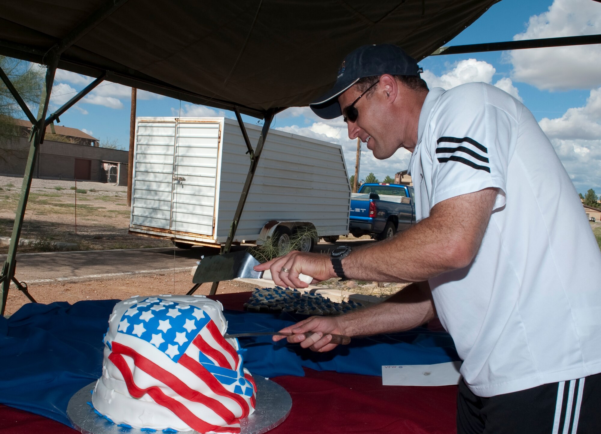 HOLLOMAN AIR FORCE BASE, N.M. -- Col. David Krumm, 49th Wing commander, cuts a U.S. Air Force birthday cake during the conclusion of Sports Day Sept. 17, 2010. Sports Day is an annual event held by the Domenici Fitness and Sports Center, which this year, coincided with the base's Air Force birthday celebration. ( U.S. Air Force photo by Airman 1st Class Joshua Turner / Released)
