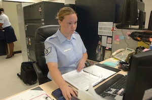LANGLEY AIR FORCE BASE, Va. -- Staff Sgt. Julie Satterfield, 1st Maintenance Operations Squadron time compliance technical order monitor, cross-references hard-copy training records to digital records in the Training Business Area Sept. 20. Satterfield’s efforts in updating the unit’s training records and TCOTs contributed to the “excellent” grade received during the recent Logistics Compliance Assessment Program evaluation, which took place Sept. 8-14. (U.S. Air Force photo/Airman 1st Class Jason J. Brown) 