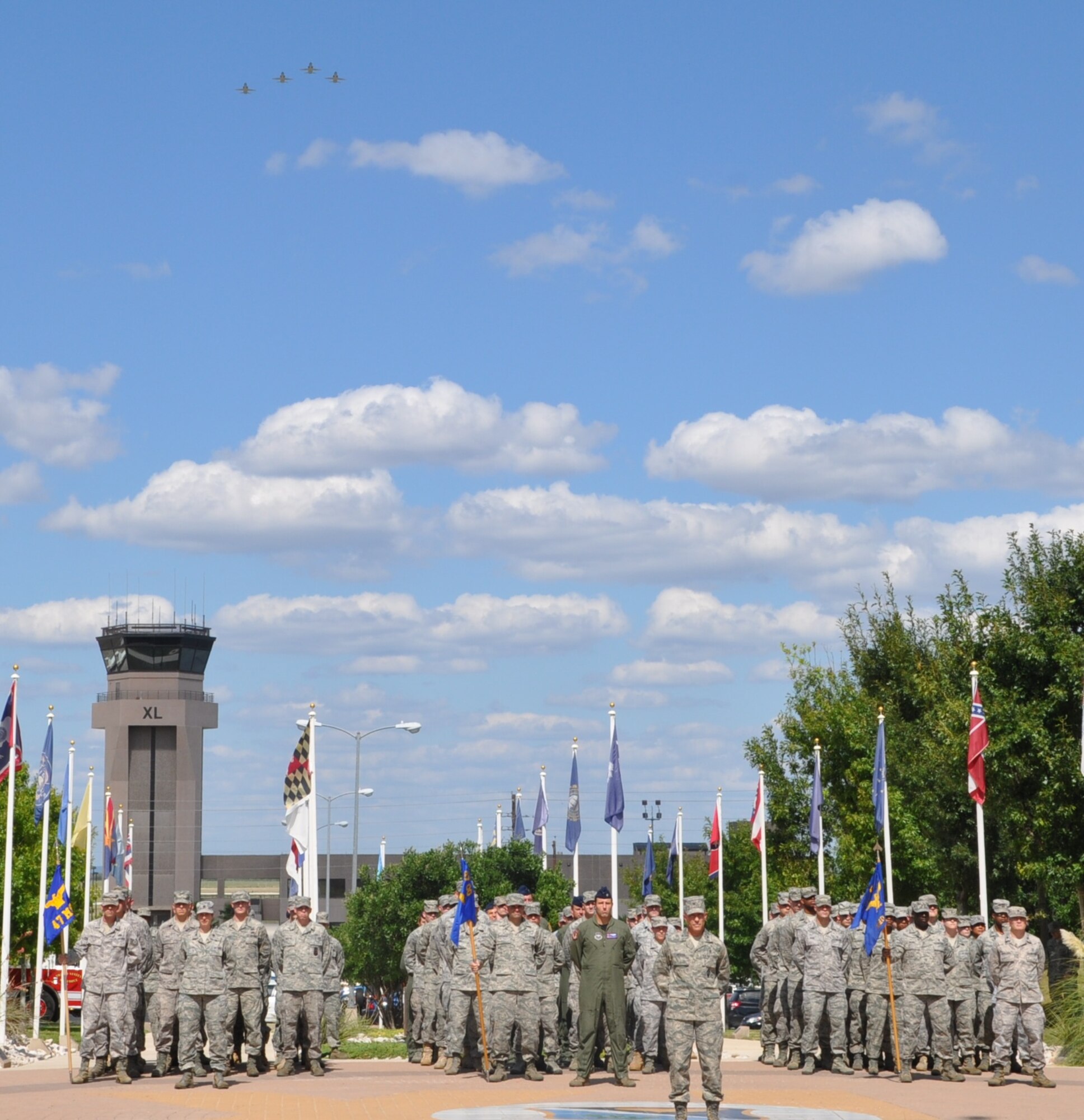 LAUGHLIN AIR FORCE BASE, Texas – A formation of Airmen commanded by Col. Bruce Peters, 47th Medical Group commander, waits to take part in a retreat ceremony at Heritage Park here Sept. 17 as four T-38 Talon aircraft perform a flyover. The ceremony was part of Laughlin’s POW/MIA day activities, which also included a luncheon at Club XL and a roundtable panel with four Vietnam veterans at Anderson Hall. (U.S. Air Force photo by Airman 1st Class Blake Mize)