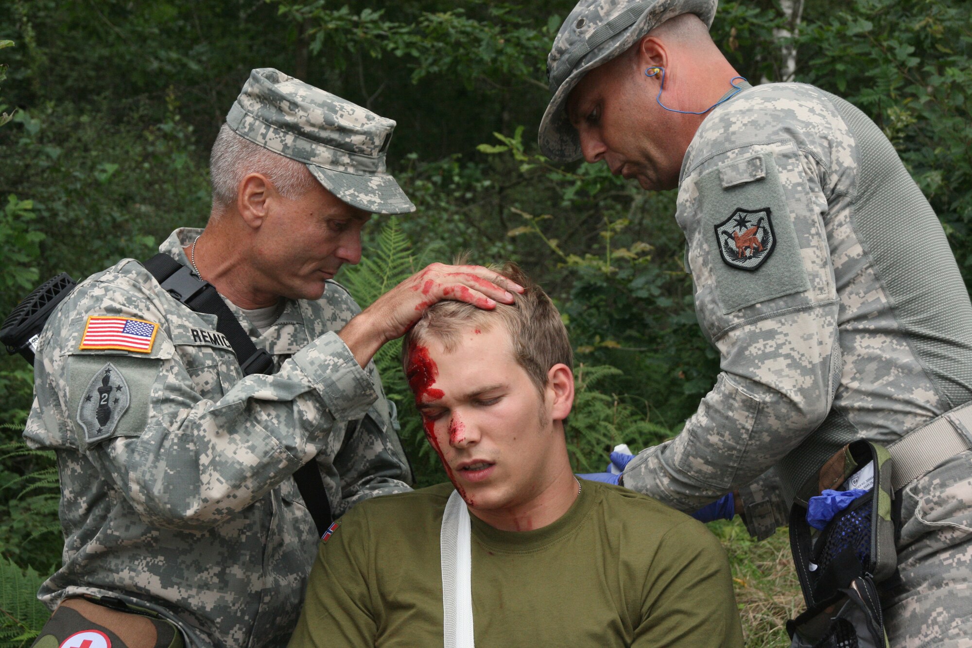 Army Capt. Daryl Remick (left) and Lt. Col. Joel Winton (right) tend to a "patient" during a training scenario during the Interallied Allied Confederation of Reserve Officers annual Congress and Military Competition in Stavanger, Norway. Colonel Winton and Captain Remick's team won first place during the Combat Casualty Care exercise. (Courtesy photo)