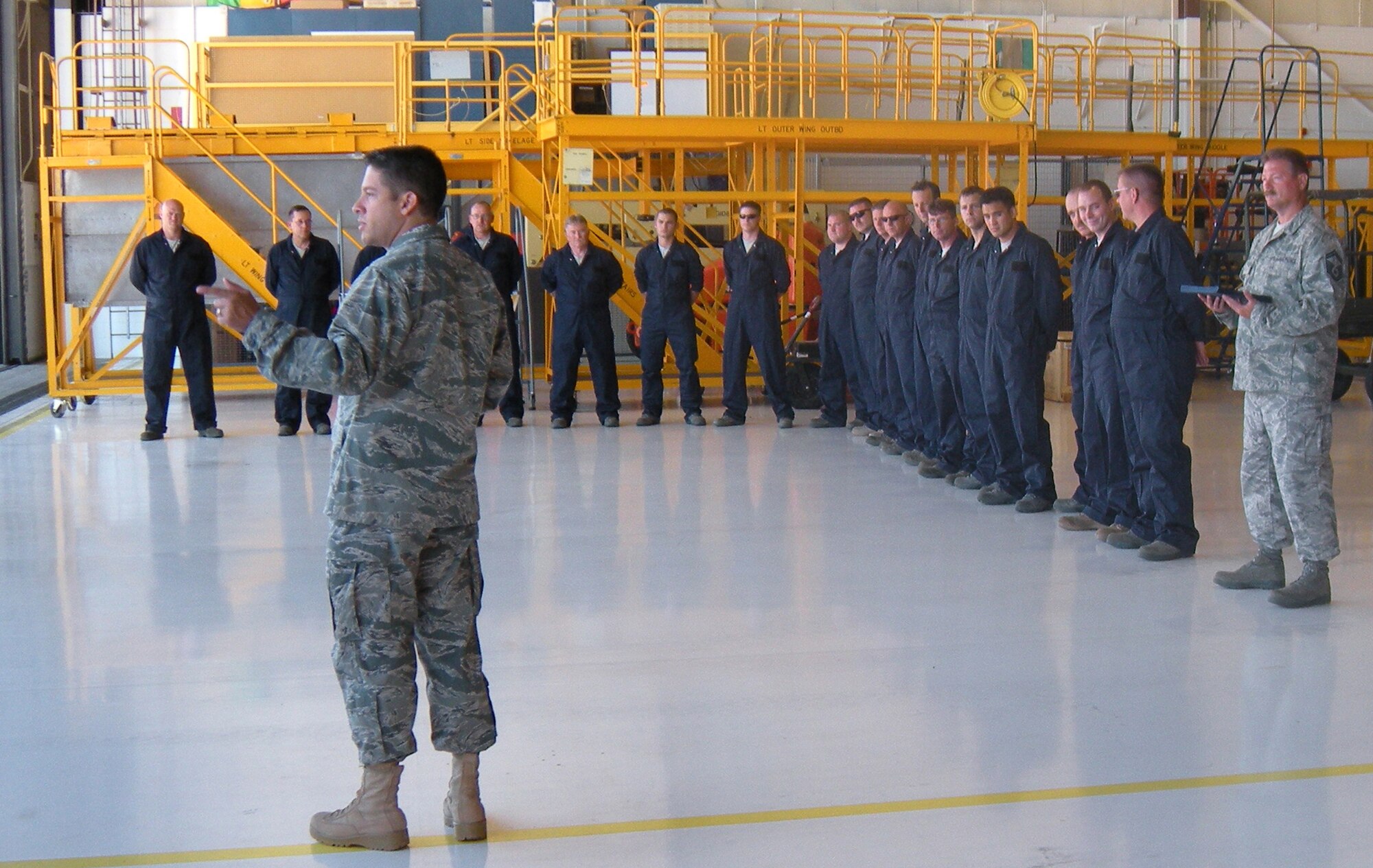 Lt. Col. Carlos Ortiz, 52nd Airlift Squadron commander, shares the importance of dedicated crew chiefs to the mission of tactical airlift Aug. 8 at Peterson Air Force Base, Colo. Colonel Ortiz, together with 302nd Maintenance Group leadership, were on hand to name 24 Air Force Reserve and Active Duty C-130 Hercules maintainers as "dedicated crew chiefs" to their respective aircraft. Dedicated crew chiefs provide additional continuity and streamline processes for maintaining the Air Force's fleet of C-130 aircraft. (U.S. Air Force photo/Staff Sgt. Jenni Deylius)