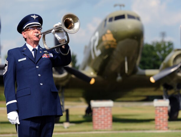 Chief Master Sgt. (Ret.) Thomas Kistler plays ?Taps? on his bugle at the close of the Prisoner of War/Missing in Action retreat ceremony on Joint Base Charleston, S.C., Sept. 17, 2010. Mr. Kistler served 29 years in the Air Force as an Air Force band member playing the tuba at events such as President Ronald Regan's internment. (U.S. Air Force photo/Senior Airman Timothy Taylor)