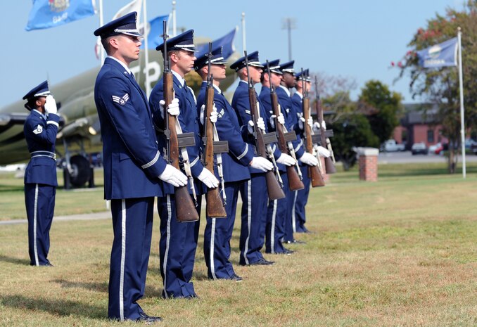 Members from the Joint Base Charleston Honor Guard stand at the position of present arms before rendering a 21-gun salute at a Prisoner of War/Missing in Action retreat ceremony on Joint Base Charleston, S.C., Sept. 17, 2010. The 21-gun salute is a tradition that honors fallen military members and is most frequently observed during military funeral honors. (U.S. Air Force photo/Senior Airman Timothy Taylor)