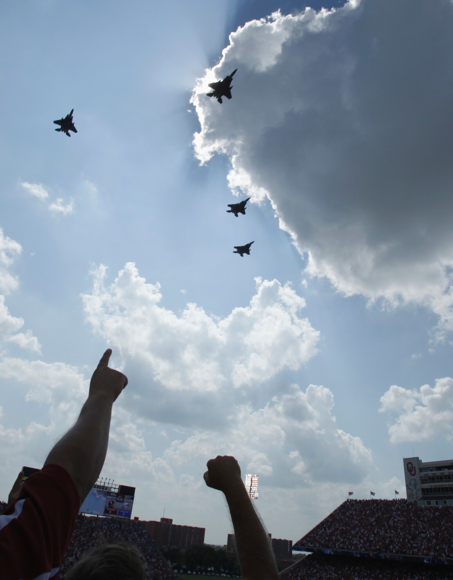 Fans cheer as four F-15E Strike Eagles out of Mountain Home Air Force Base, Idaho do a flyover before the University of Oklahoma Sooners and the Air Force Falcons at Gaylord Family-Oklahoma Memorial Stadium Sept 18. Col. Ron Buckely, 366th Fighter Wing commander led the formation. (courtesy photo by Steve Sisney)