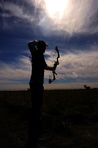 MINOT AIR FORCE BASE, N.D. -- Senior Airman Wade Ottman, 5th Security Forces Squadron tower operator, aims at a fake moose at the 3-D archery range during a tournament held by the Outdoor Recreation Center here Sept 18. The Outdoor Recreation Center holds tournaments annually and occasionally gives a brand new bow to the first place winner. Events such as these are integral to the team morale of Air Force Global Strike Airmen stationed here. (U.S. Air Force photo by Airman 1st Class Aaron-Forrest Wainwright)