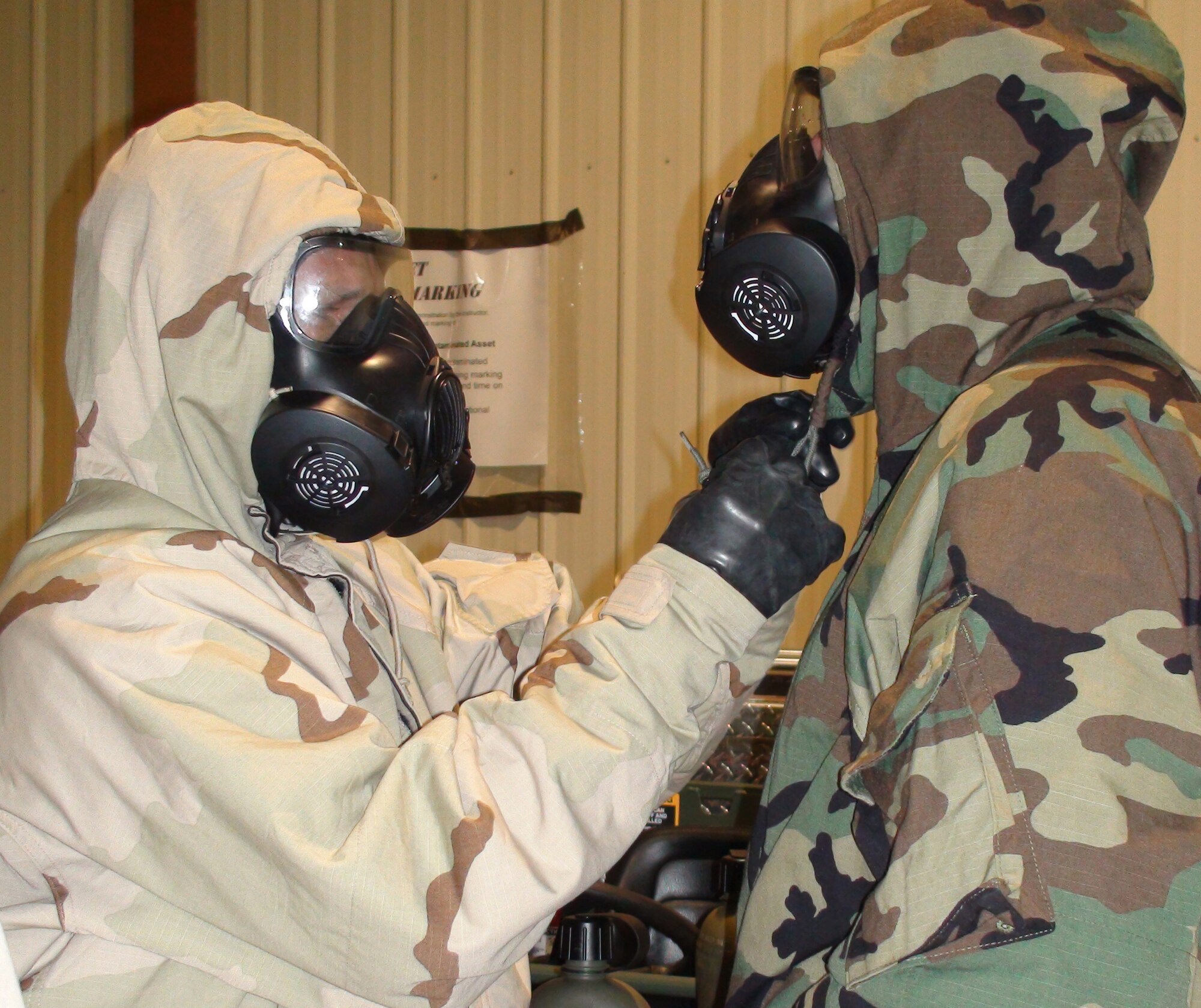 Reservists in the 476th Fighter Group, Moody Air Force Base, Ga., train using gas masks and chemical protection suits in preparation for a deployment to Afghanistan in September 2010. Twenty-five reservists from the group will deploy with Regular Air Force Airmen from Moody's 23rd Fighter Group.  (U.S. Air Force photo/Tech. Sgt. Katie Brown)